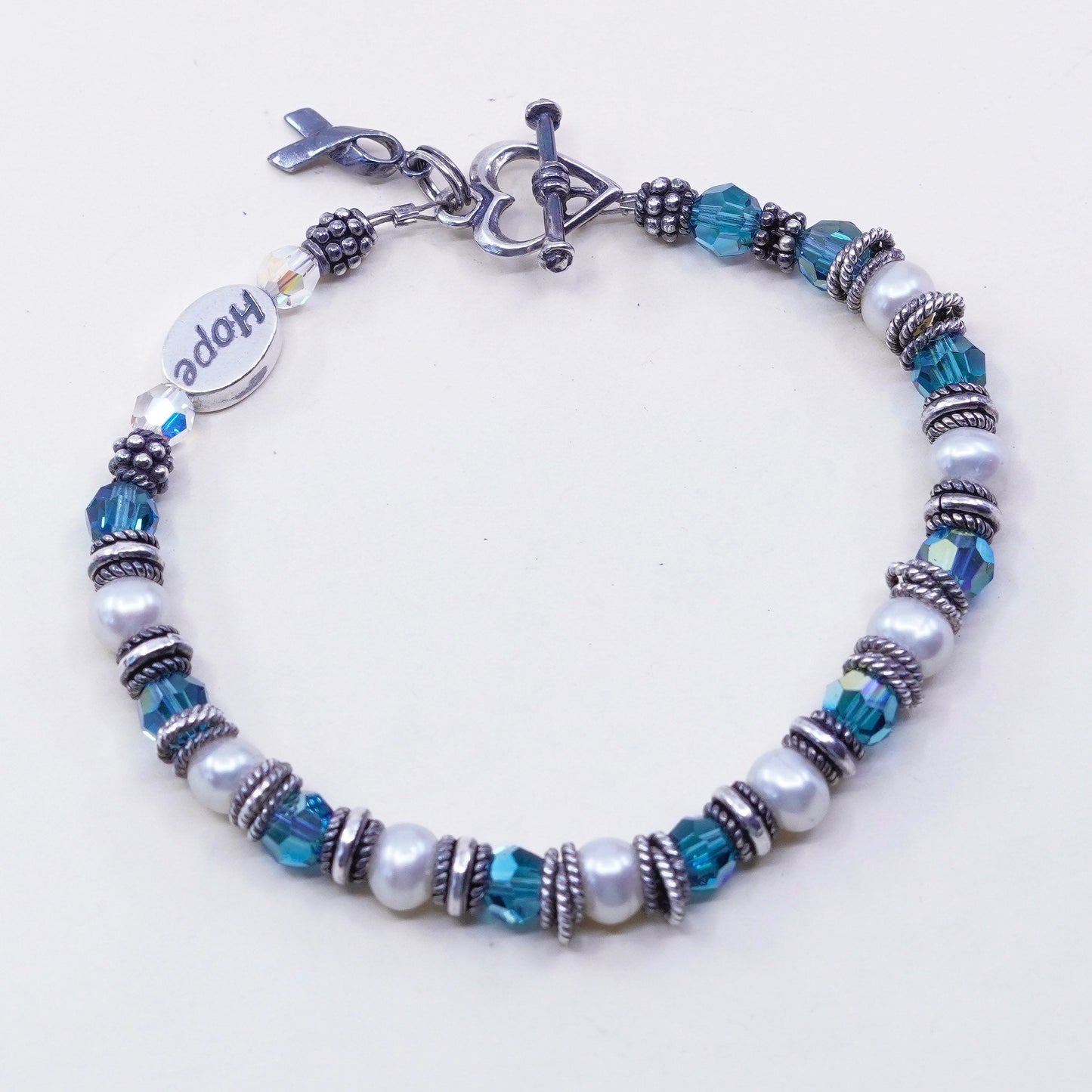 7”, Sterling 925 silver bracelet, pearl blue crystal and breast cancer ribbon