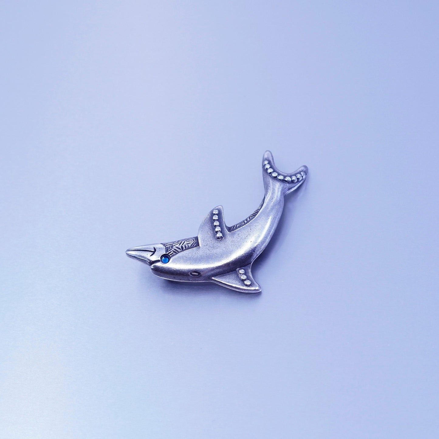 Vintage newpro silver tone dolphin brooch with blue eye