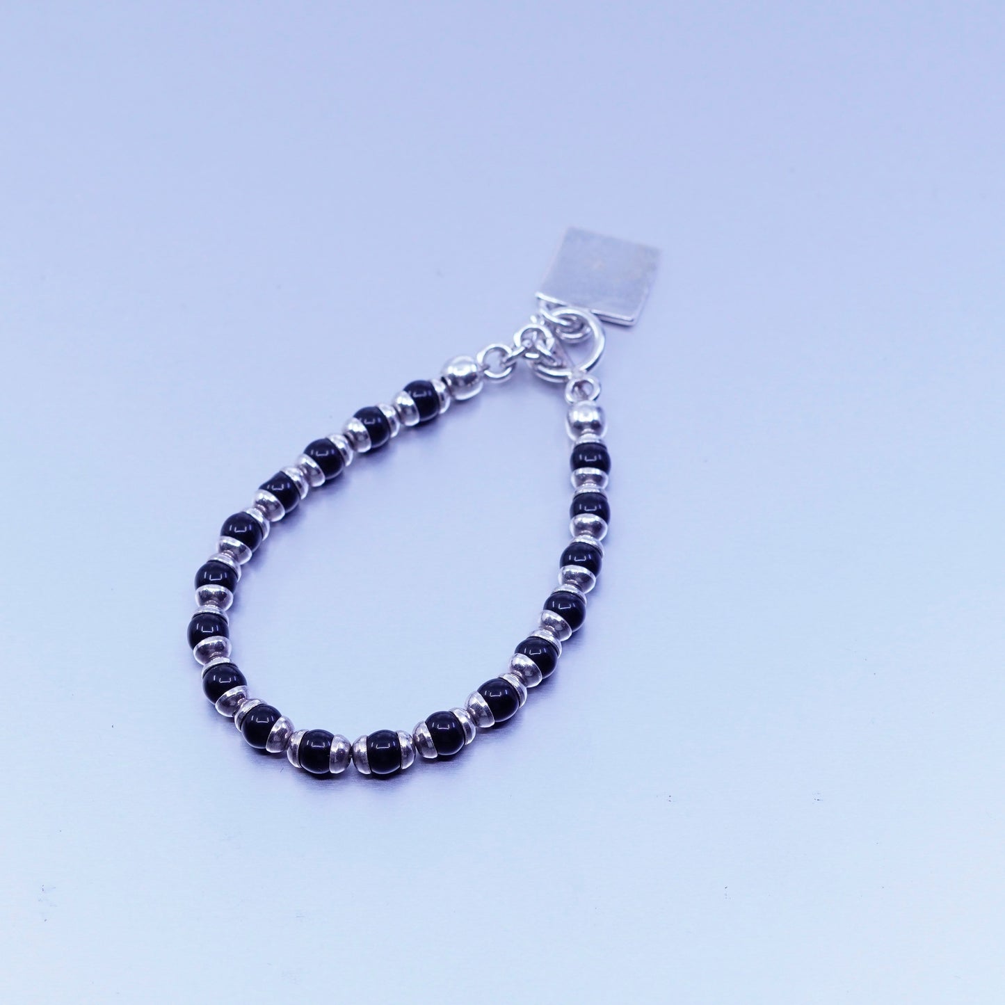 6.75”, vintage Sterling 925 silver bracelet obsidian beads and square tag charm