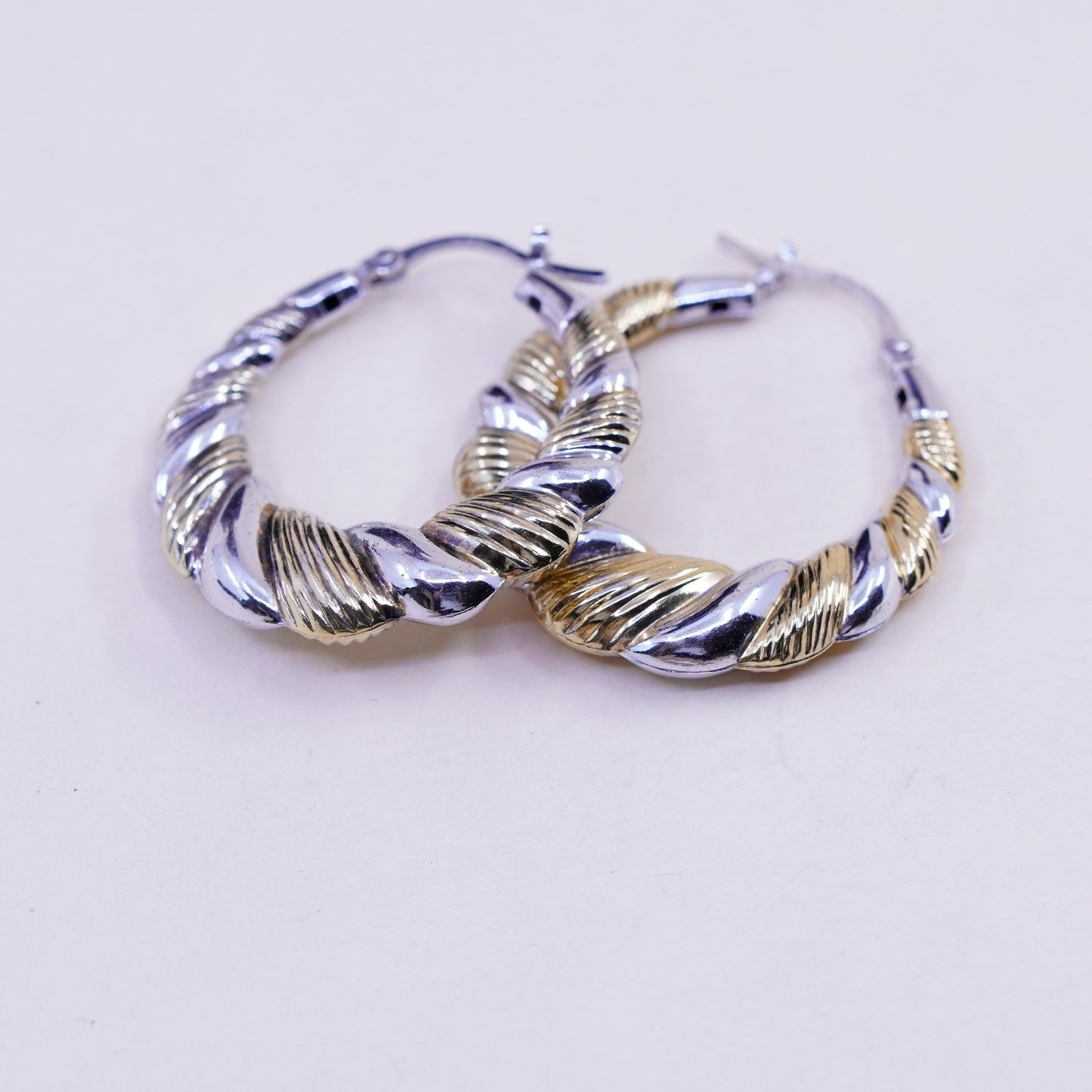 1.25”, two tone sterling silver loop earrings, Ribbed twisted hoops, huggie