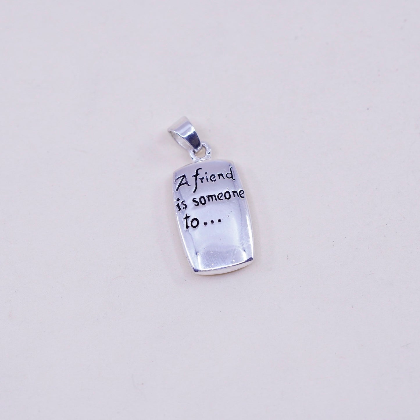 Sterling silver pendant, 925 tag “a friend is someone to dream cry sing laugh