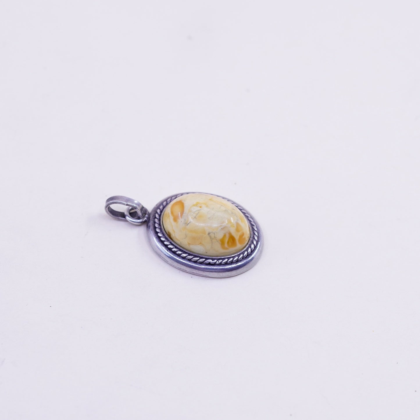 Vintage sterling 925 silver handmade pendant with oval amber