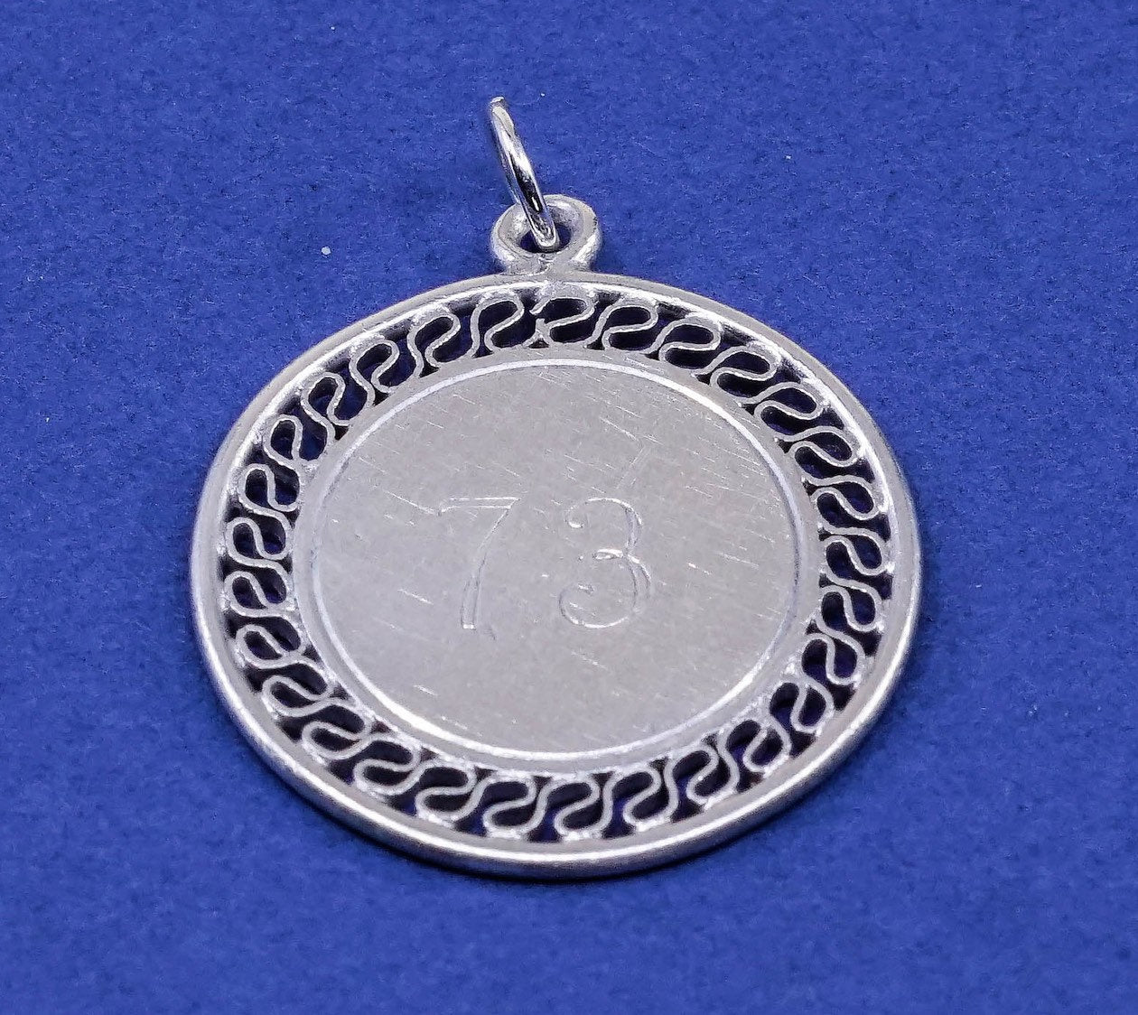 vtg sterling silver handmade pendant, 925 charm engraves “73”