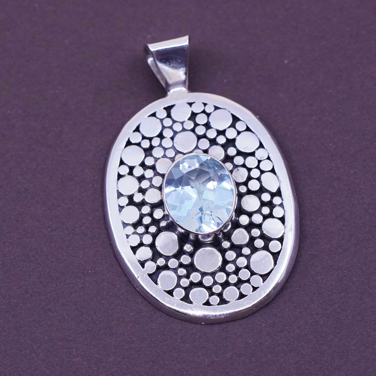 vtg Sterling silver handmade pendant, 925 pebble textured oval with blue topaz
