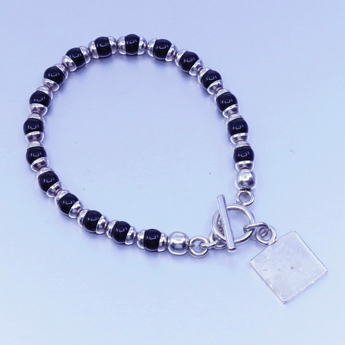 6.75”, vintage Sterling 925 silver bracelet obsidian beads and square tag charm