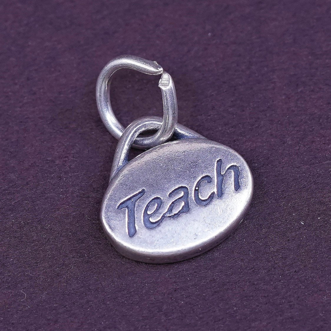 vtg SLC Sterling silver handmade charm, 925 tag pendant embossed “teach”