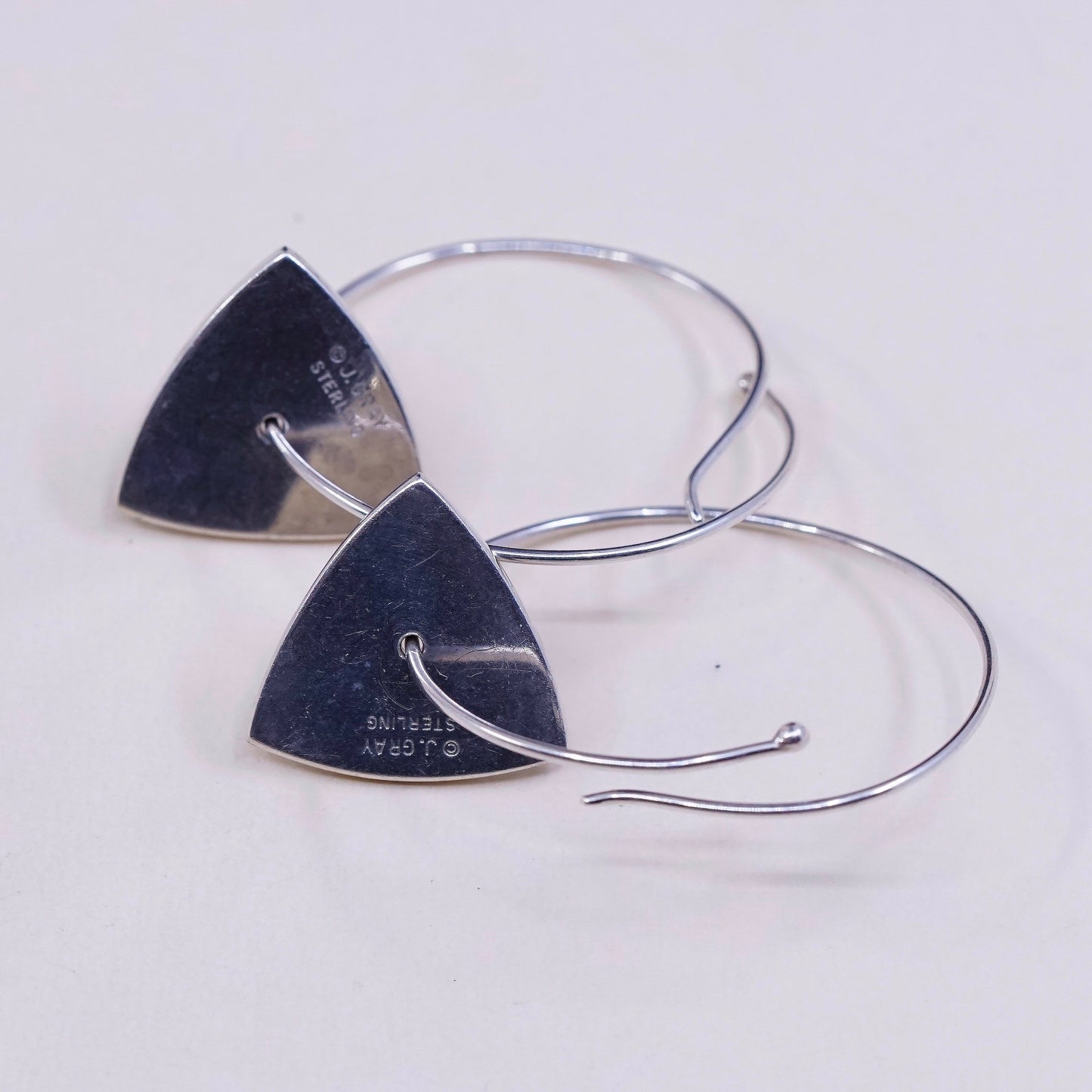 1.25”, vtg jeff gray sterling silver wrap hoops with swirl tag dangle, earrings