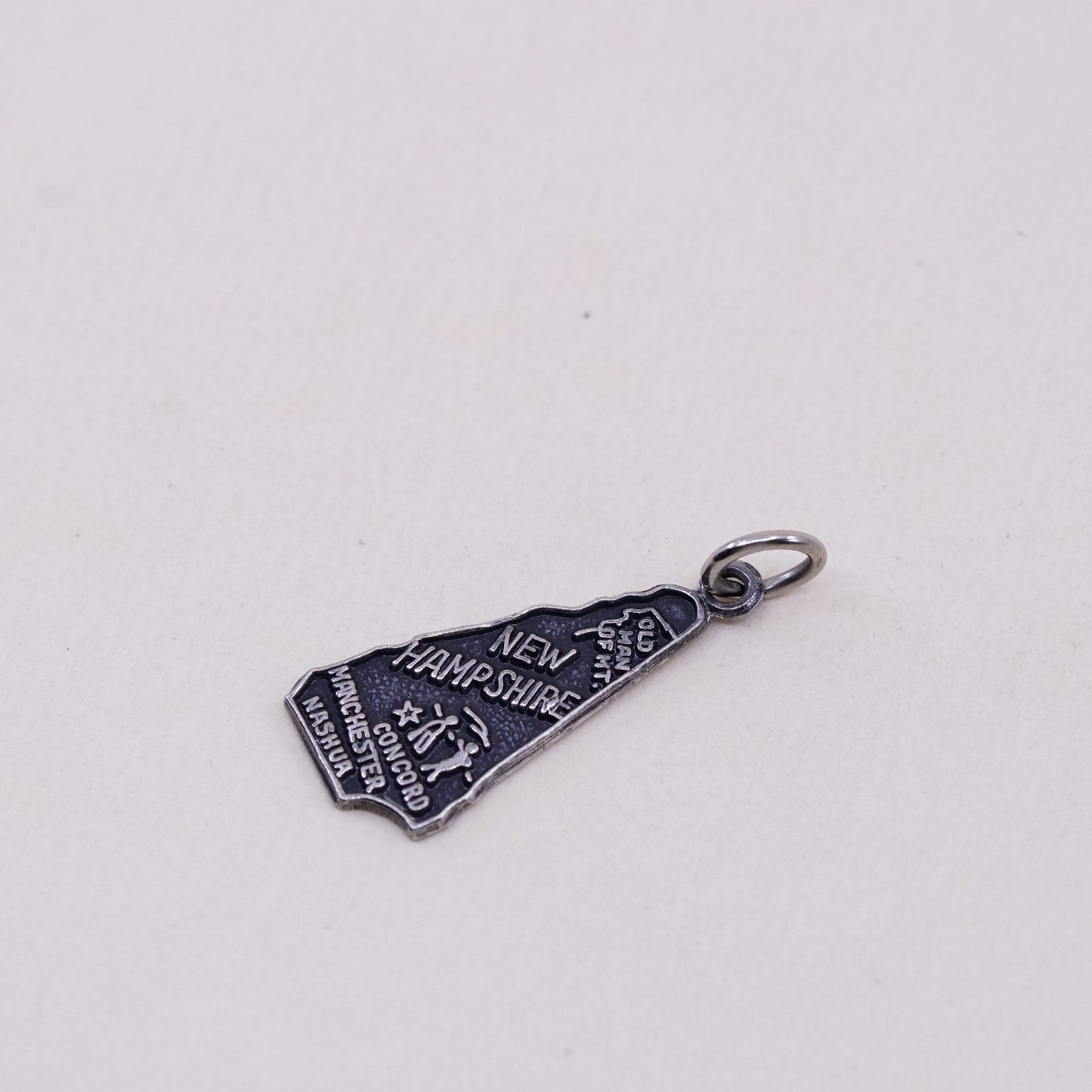 Vintage sterling handmade traveler pendant, 925 New Hampshire state tag