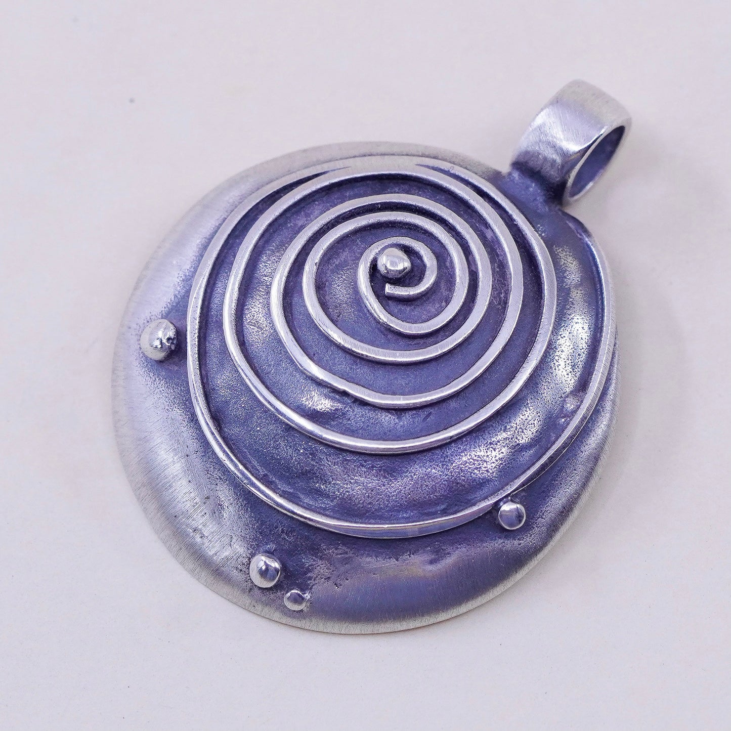 Vintage sterling 925 silver handmade hammered pendant with wave swirl embossed