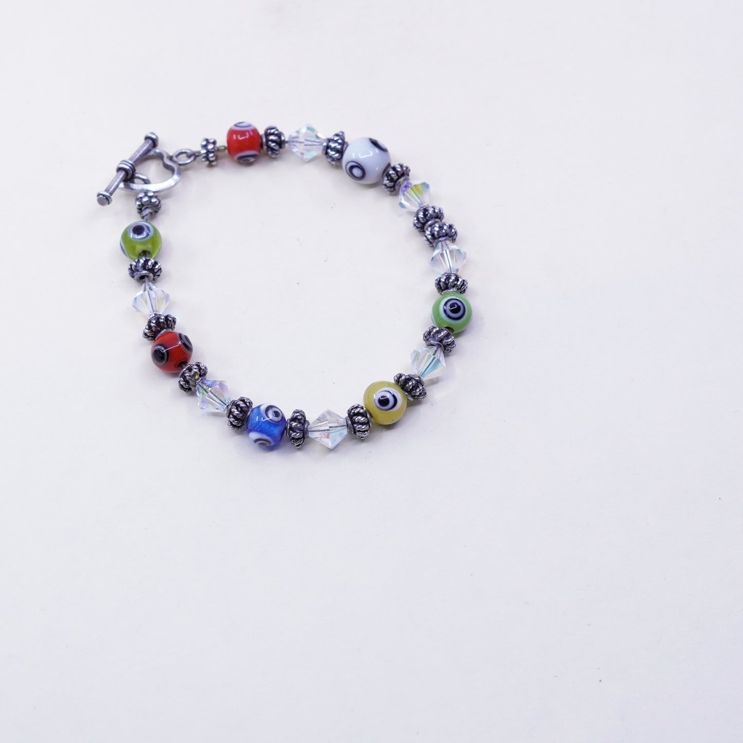 7”, handmade sterling silver bracelet, glass evil eye beads and heart closure