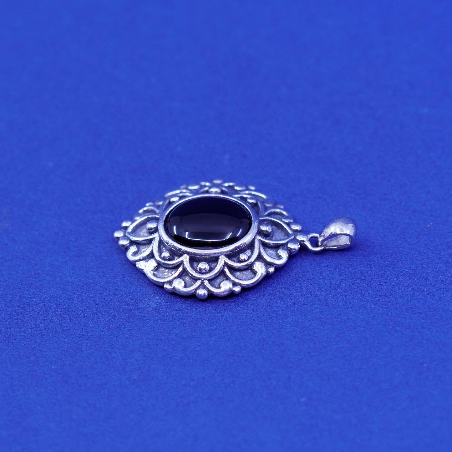 Vintage Sterling 925 silver handmade pendant with oval onyx and swirly relief