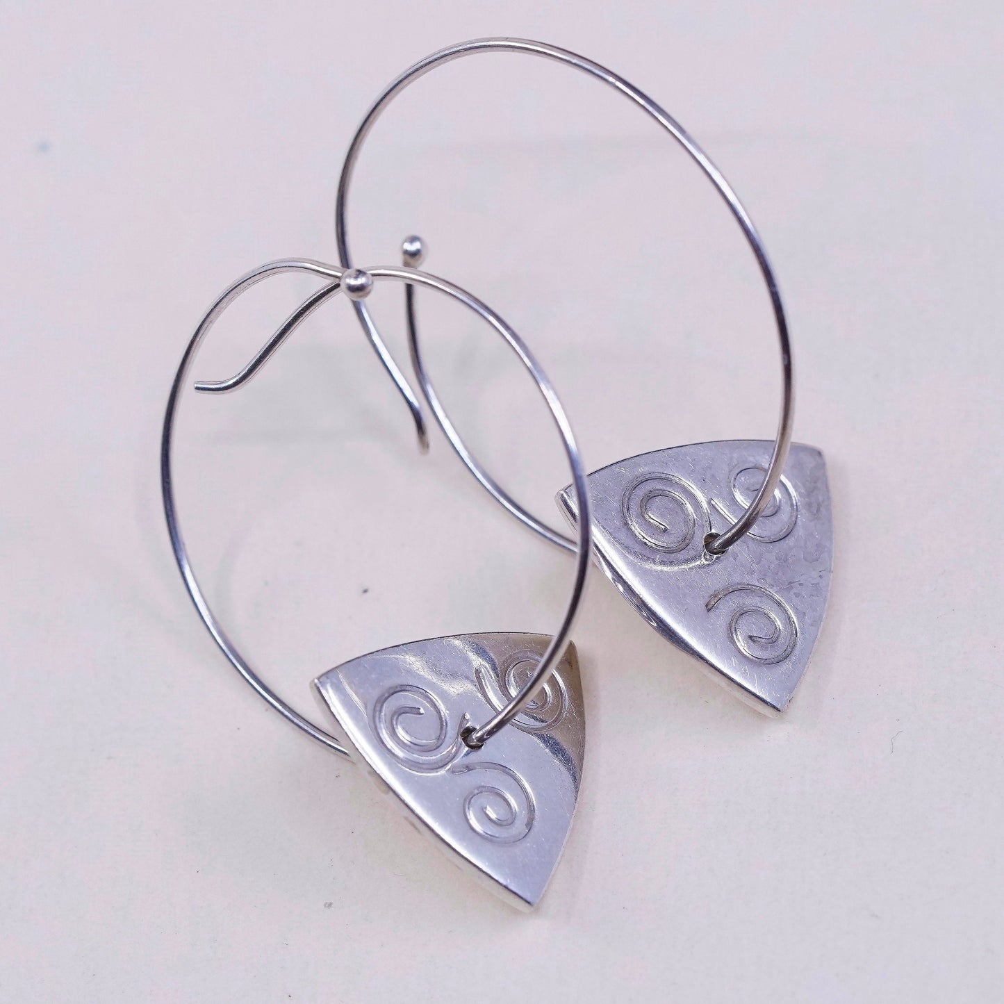 1.25”, vtg jeff gray sterling silver wrap hoops with swirl tag dangle, earrings
