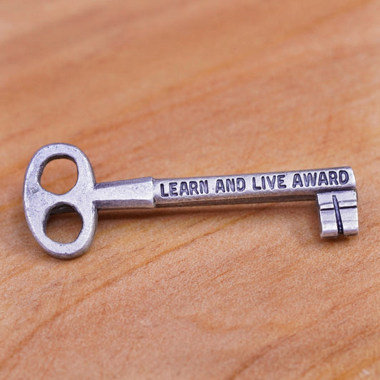 Vintage handmade sterling 925 silver key shaped brooch with “learn live award”