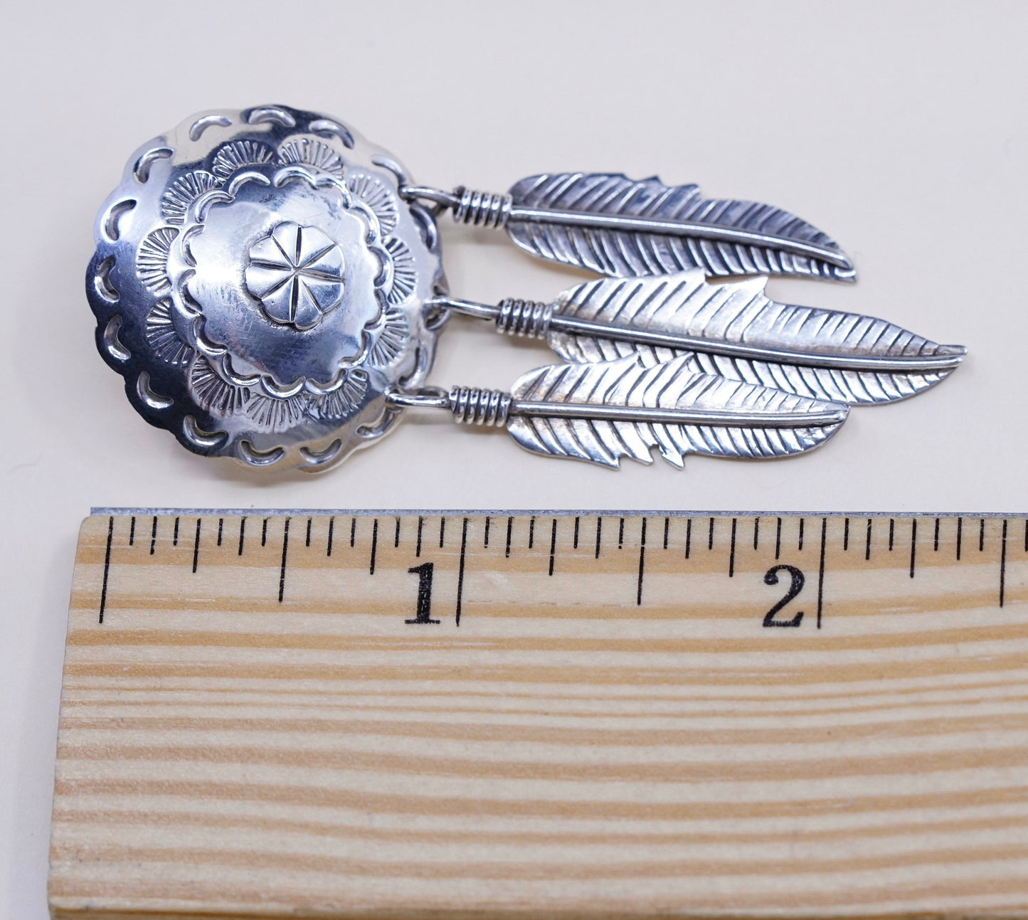 Vintage southwestern Sterling silver handmade disc earrings with feather