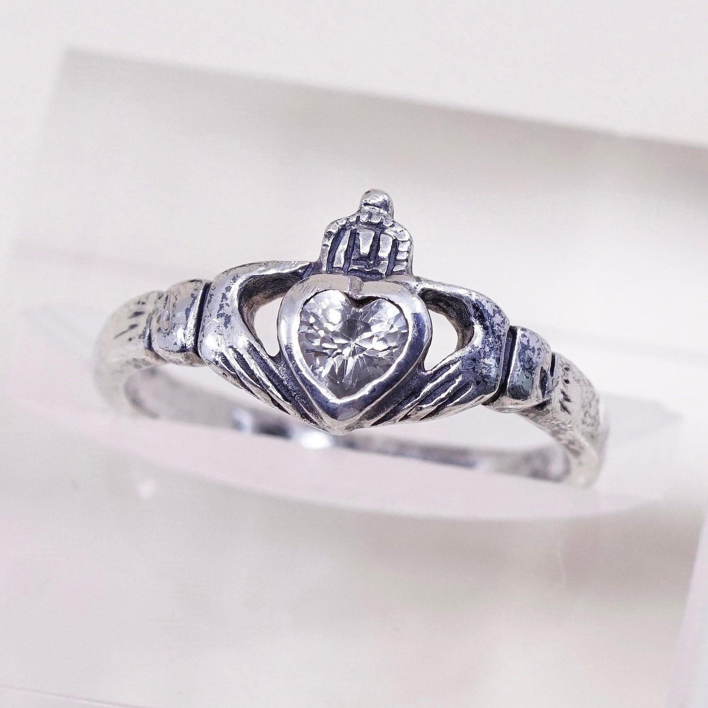 Size 7.25, Vintage sterling 925 silver claddagh ring, holding Cz heart band