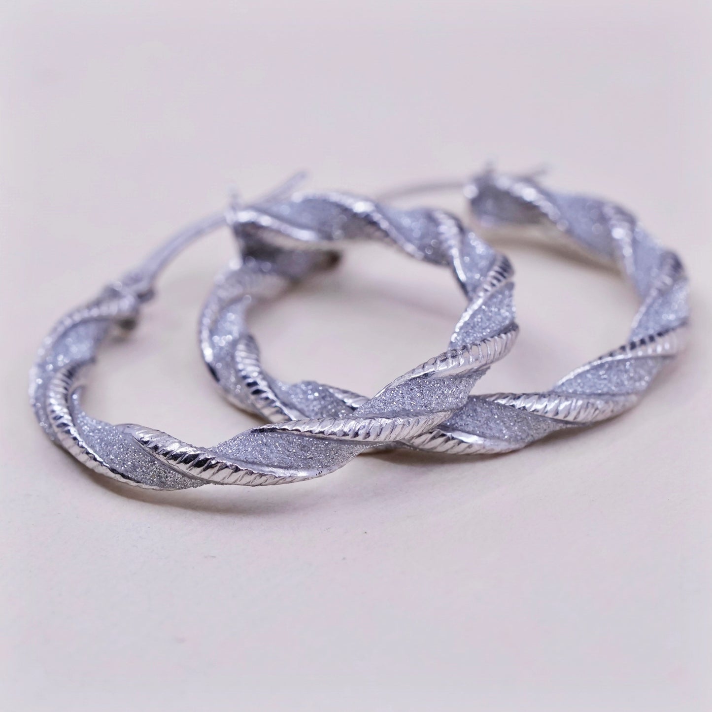 1.25”, sterling silver handmade earrings, 925 huggie, twisted glittering hoops