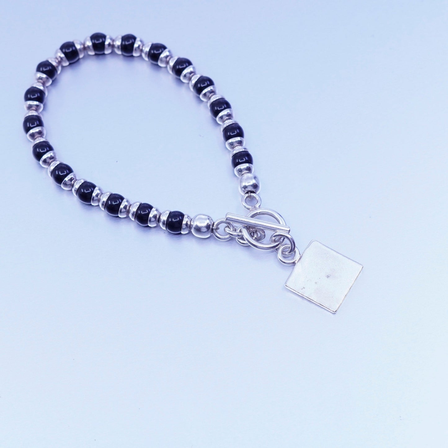 6.75”, vintage Sterling 925 silver bracelet obsidian beads and square tag charm