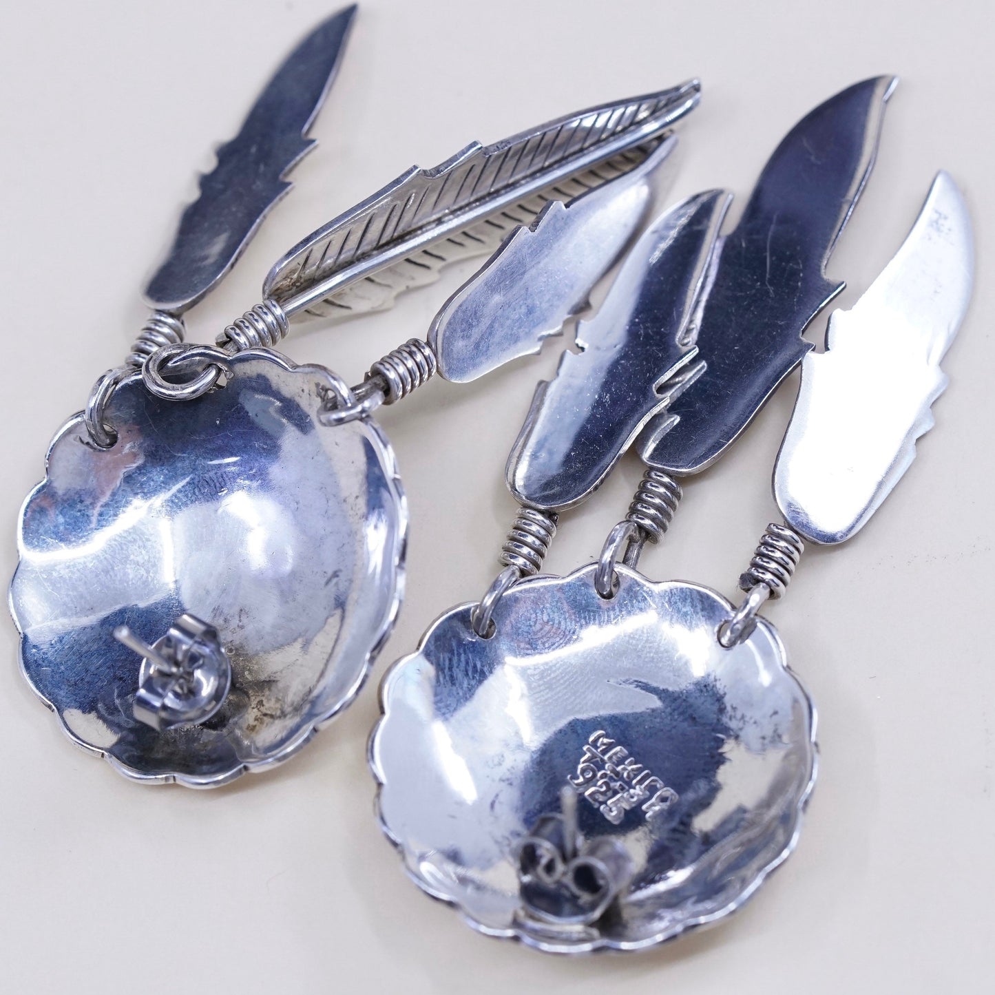 Vintage southwestern Sterling silver handmade disc earrings with feather