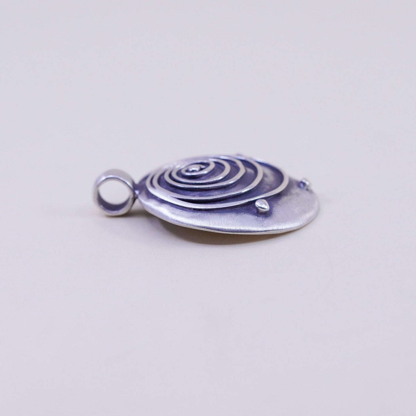 Vintage sterling 925 silver handmade hammered pendant with wave swirl embossed