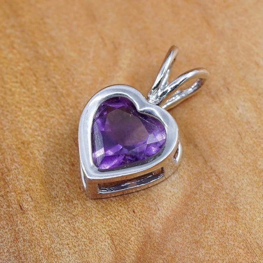 0.6g, Carla 14K white gold heart pendant with amethyst, stamped Carla 14K