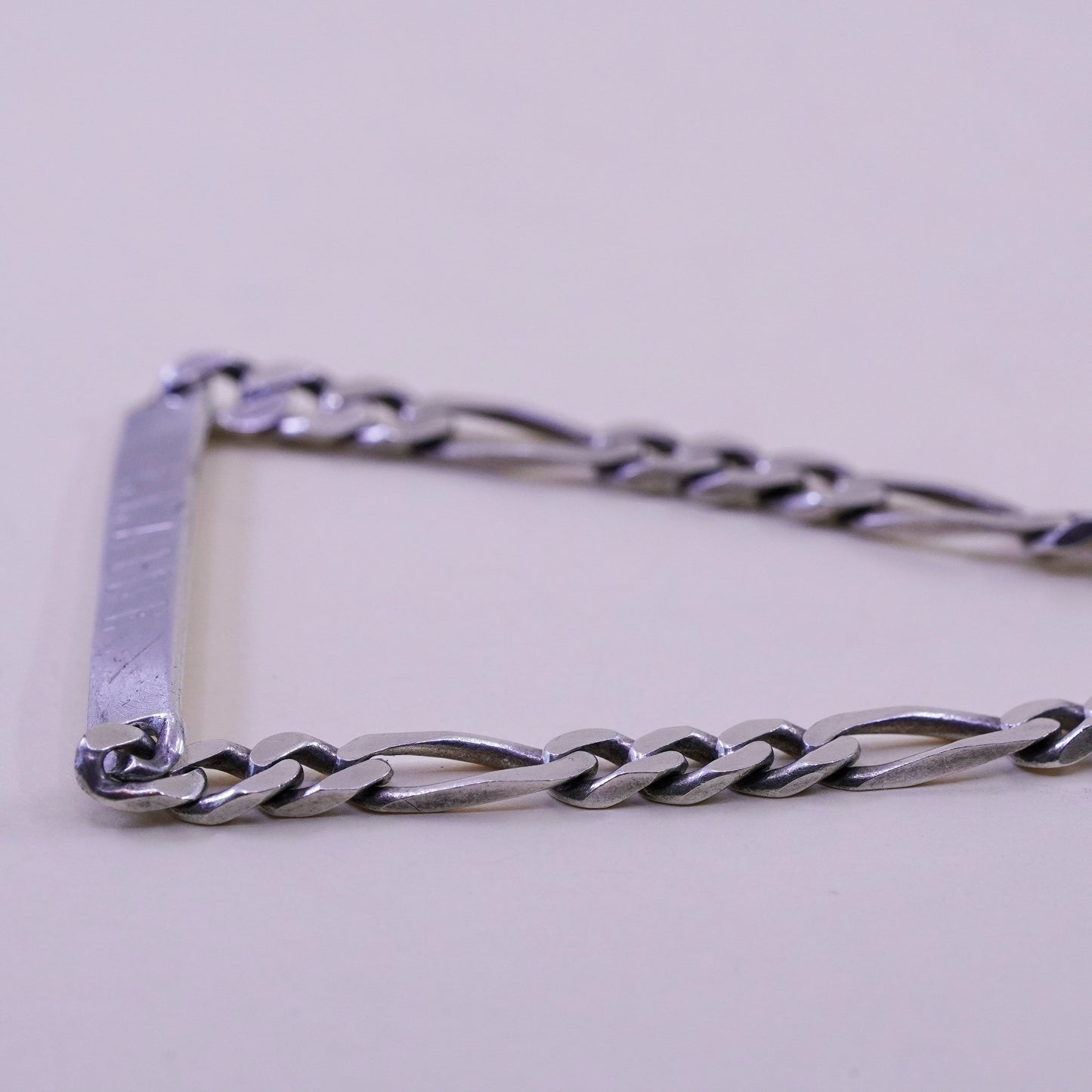 8” Sterling silver bracelet, 925 figaro chain name tag engraved “Elaine”