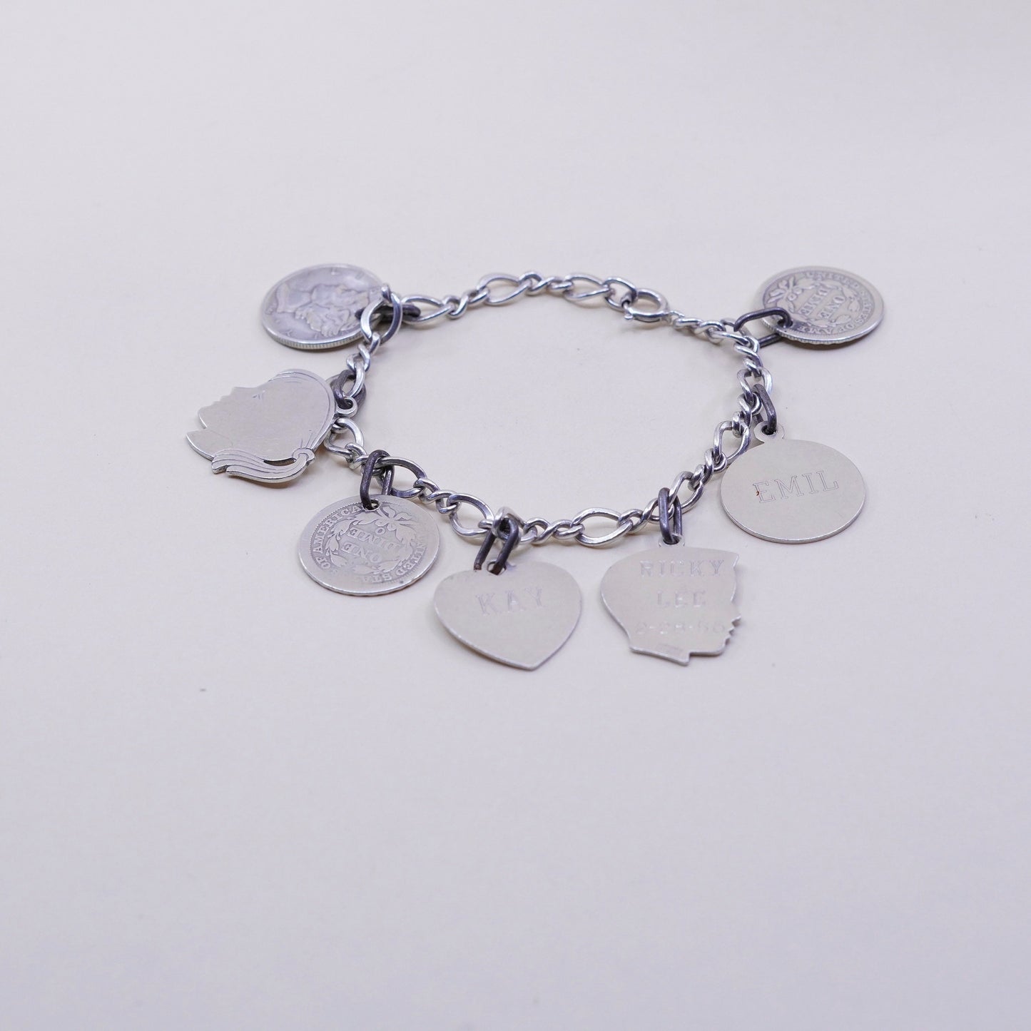 7”, sterling silver handmade bracelet, 925 Figaro chain w/ coin charms names
