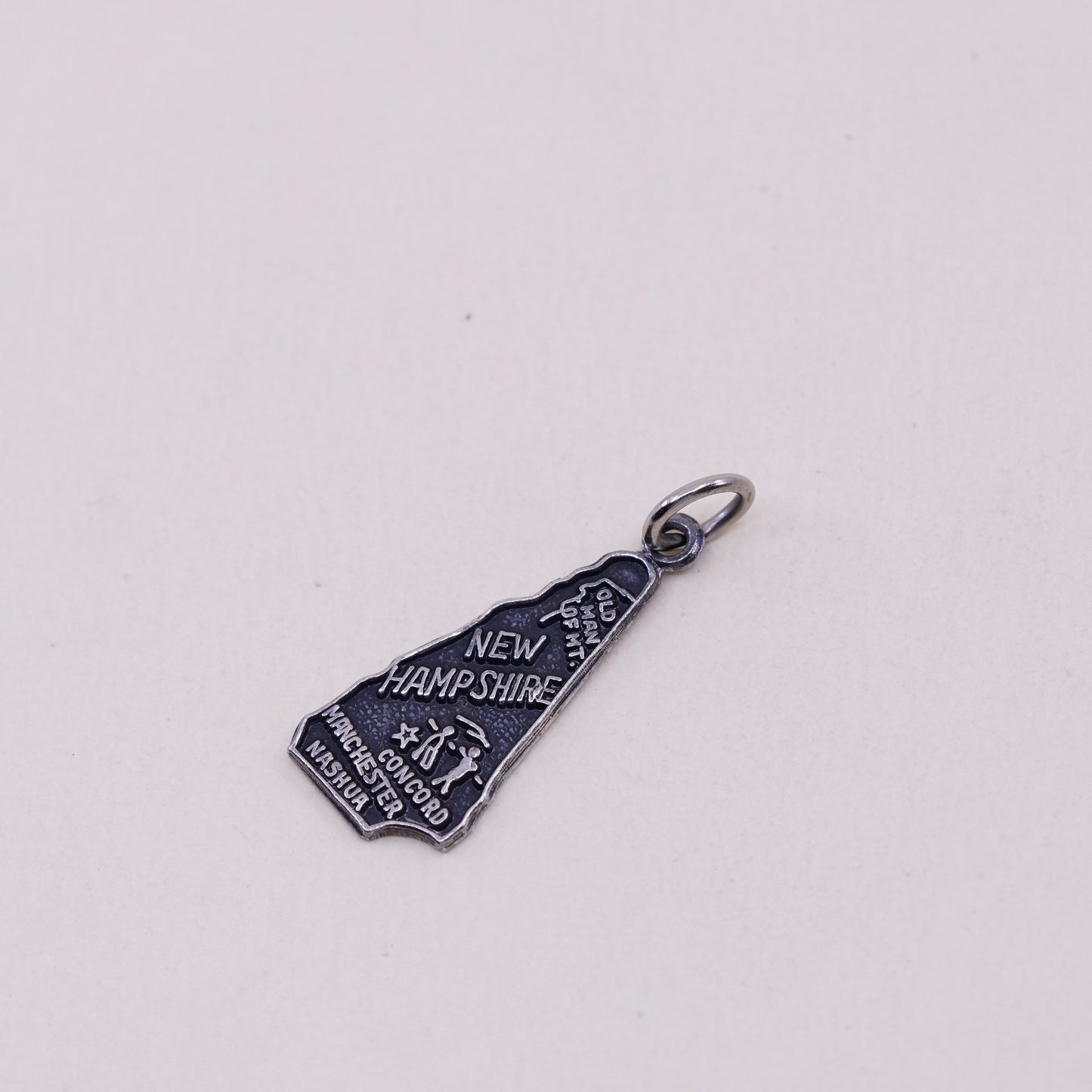 Vintage sterling handmade traveler pendant, 925 New Hampshire state tag