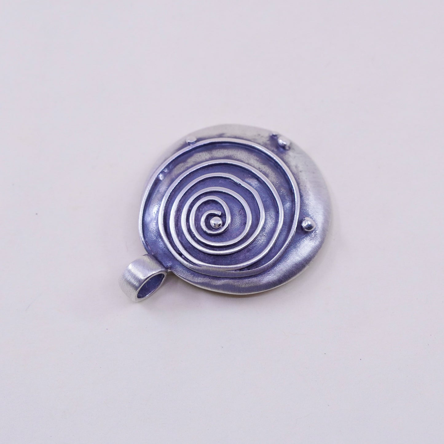 Vintage sterling 925 silver handmade hammered pendant with wave swirl embossed