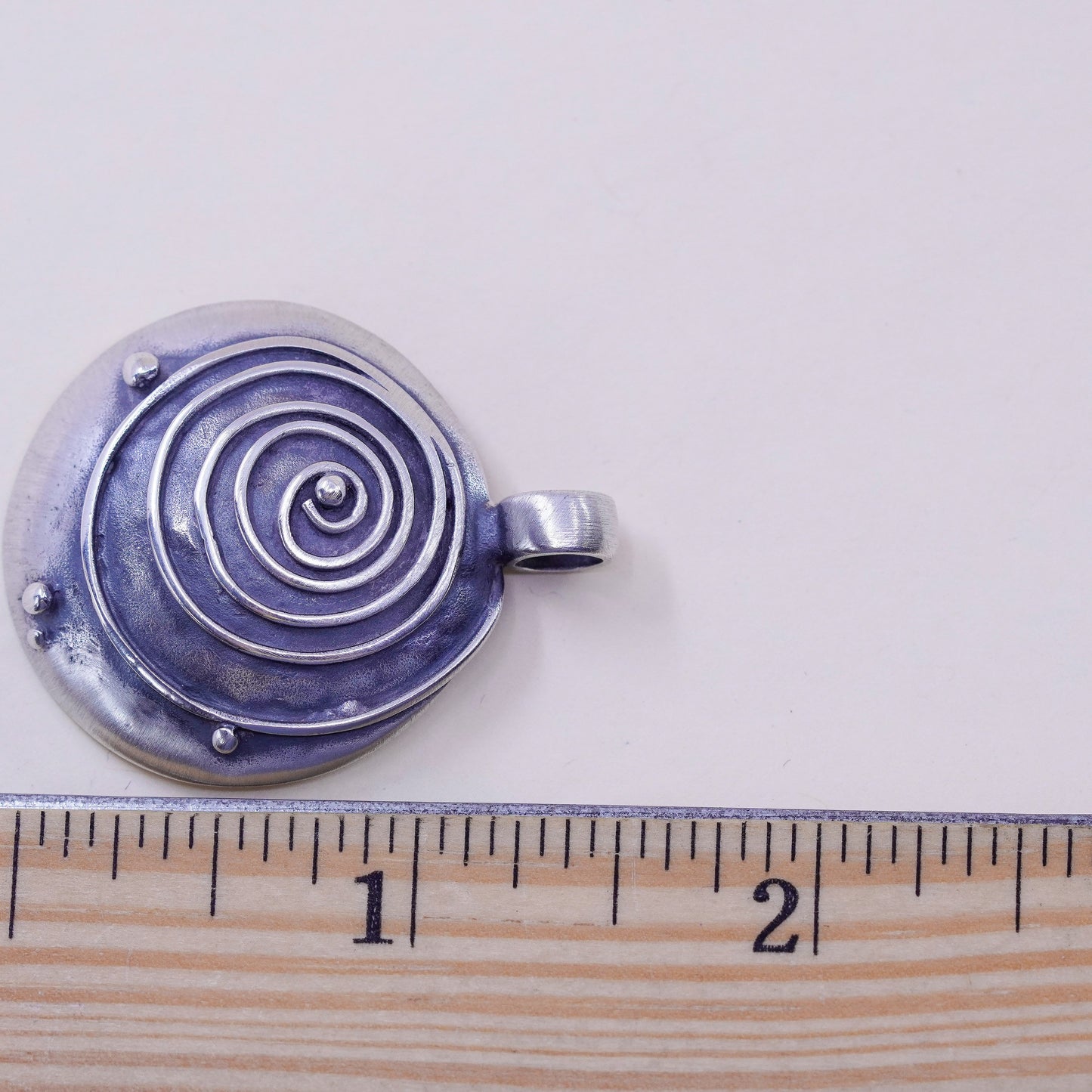 Vintage sterling 925 silver handmade hammered pendant with wave swirl embossed