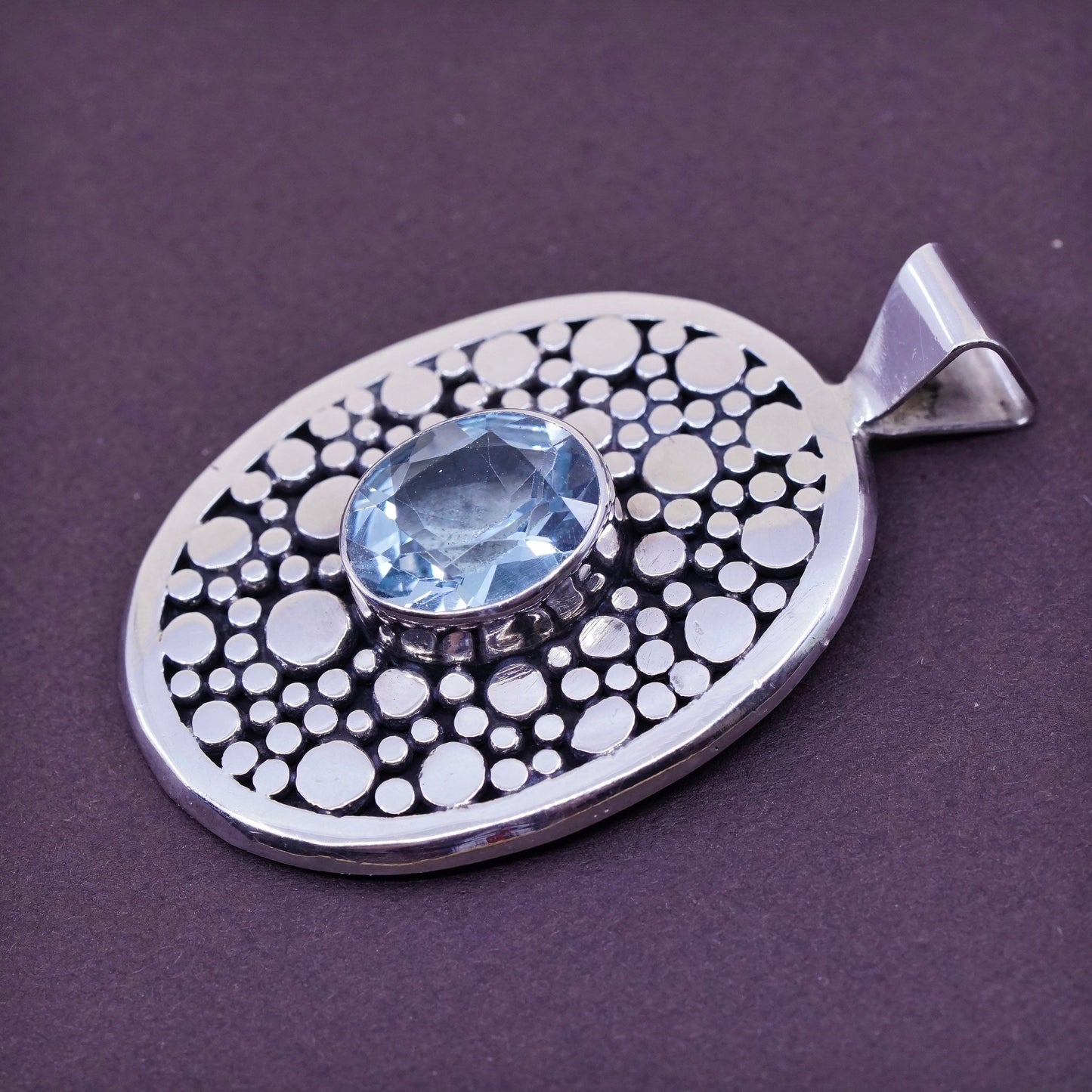 vtg Sterling silver handmade pendant, 925 pebble textured oval with blue topaz